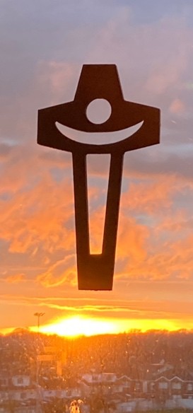 Cross with cut out of h